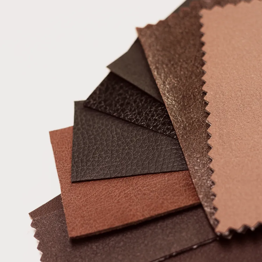 Non-woven fabric swatches in several browns and surface textures